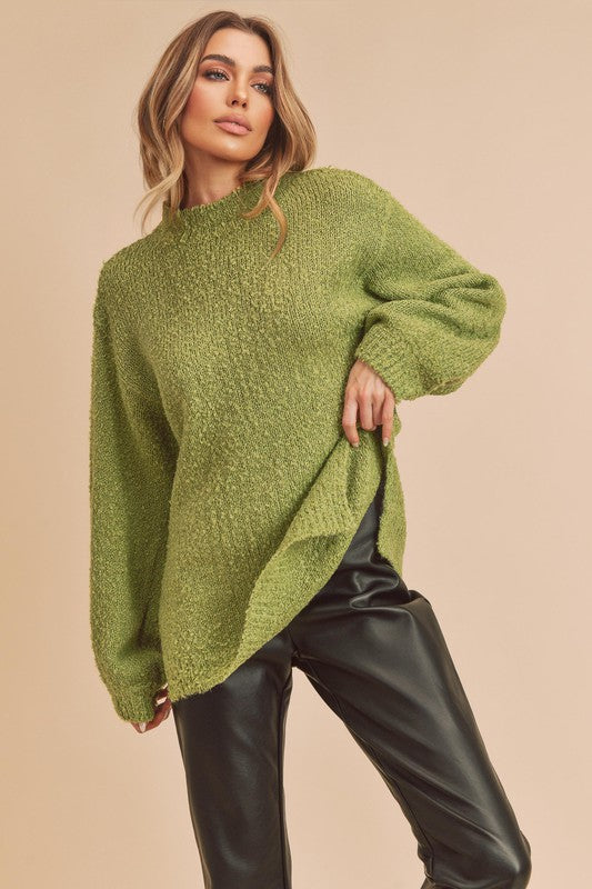 Cozy olive-green Aemi + Co loose fit mock neck knit sweater with side slits