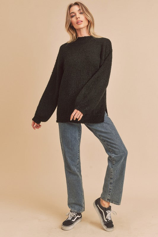Black textured knit sweater with side slit hem in small