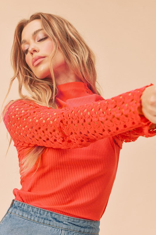 Vibrant orange Aemi + Co mock neck top with lace crochet sleeves, size small