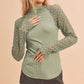 Sage green Aemi + Co mock neck top with ribbed body and lace sleeves, small