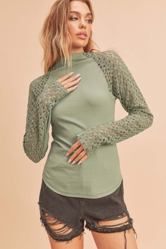 Sage green Aemi + Co mock neck top with ribbed body and lace sleeves, small