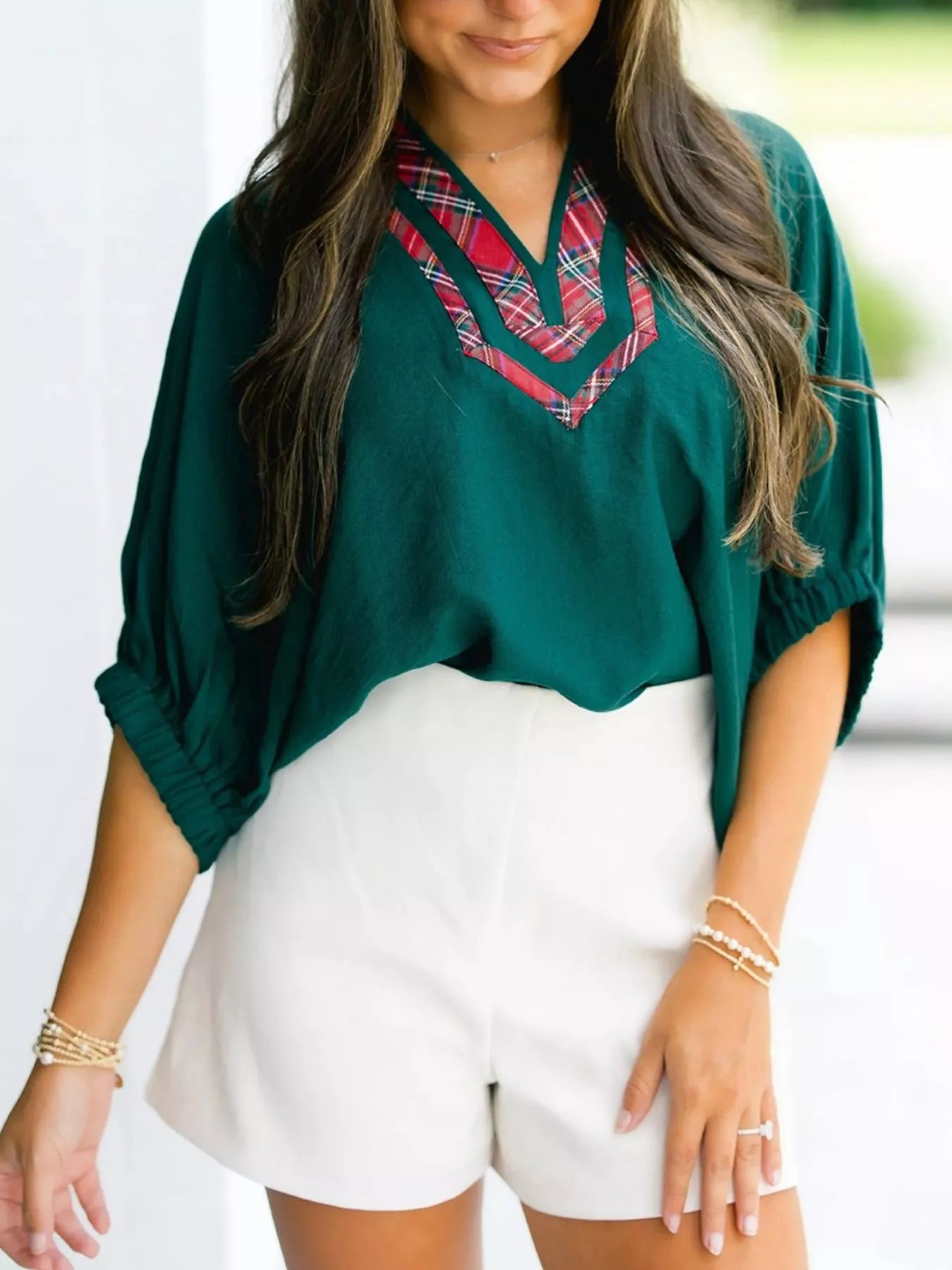 Daverri Fashions emerald green blouse with red black plaid V-neck trim