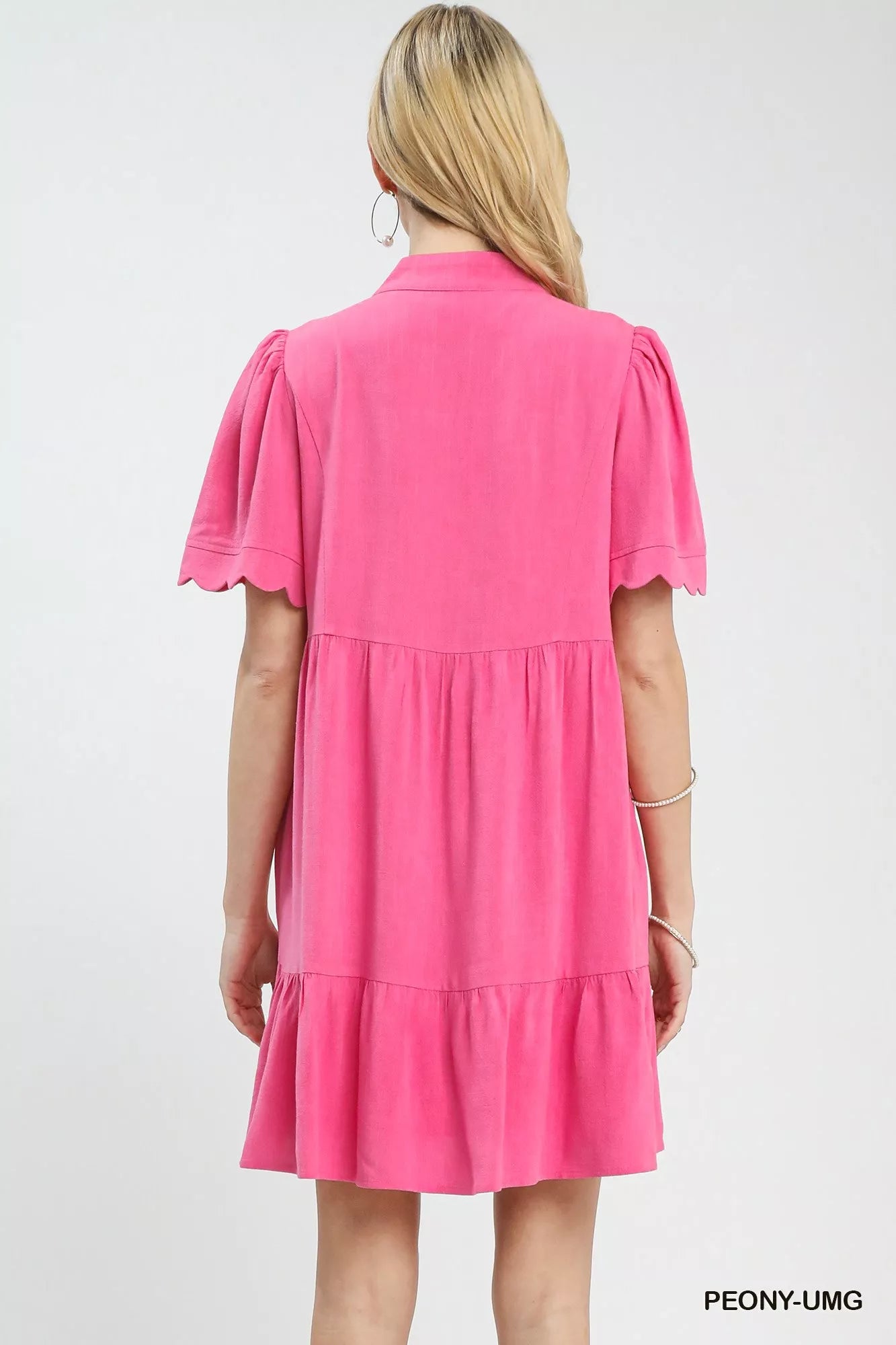 Umgee linen tiered babydoll dress in vibrant pink with scalloped puffed sleeves