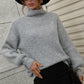 Cozy light gray ribbed knit turtleneck sweater with balloon sleeves