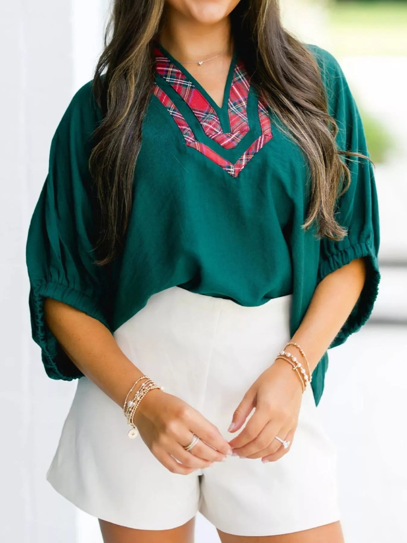 Emerald green Daverri Fashions blouse with red black plaid V-neck trim
