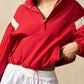 Red cropped bomber jacket with white panels and silver buttons on Half Snap hoodie