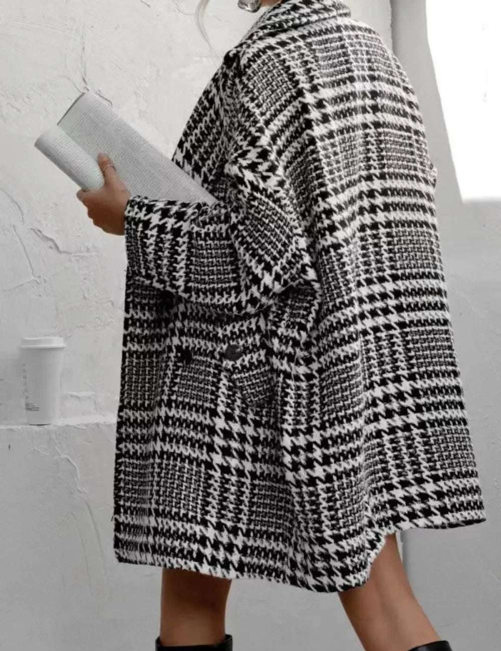 Black and white houndstooth collared long sleeve coat with oversized pockets