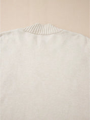 White pleated collar mock neck sweater with textured sheen