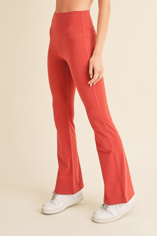 Women’s coral high-rise flared yoga pants in buttery soft stretch fabric