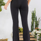 Black high-waisted flared leggings in butterysoft fabric with side pockets