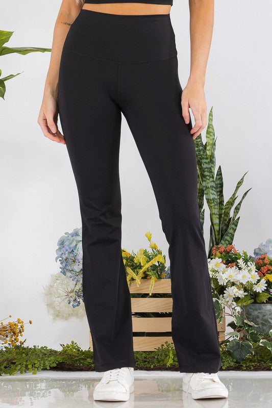Black high-waisted butterysoft yoga flare pants in stretchy fabric