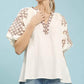 Umgee embroidered sleeve top with cream blouse and brown paisley neckline