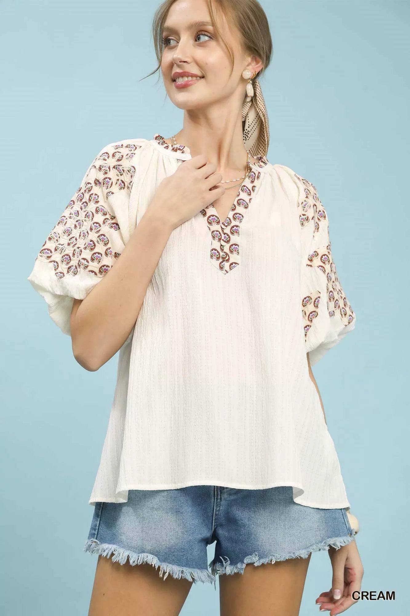Umgee embroidered sleeve top with cream blouse and brown paisley neckline