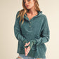 Teal distressed cotton Washed Vivi Pullover hoodie with buttoned placket and ribbed cuffs