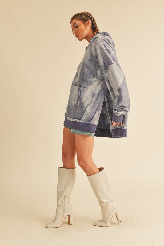 Woman in Kalia Tie Dye Hoodie with faded blue gray pattern
