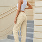 High waisted beige cargo pocket jeans with drawstring waistband