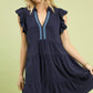 Navy blue Umgee Linen Tiered Baby Doll Dress with ruffled sleeves and light blue chain embroidery