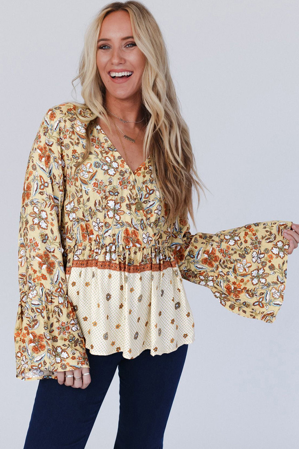 Yellow floral printed bell sleeve V-neck peplum blouse