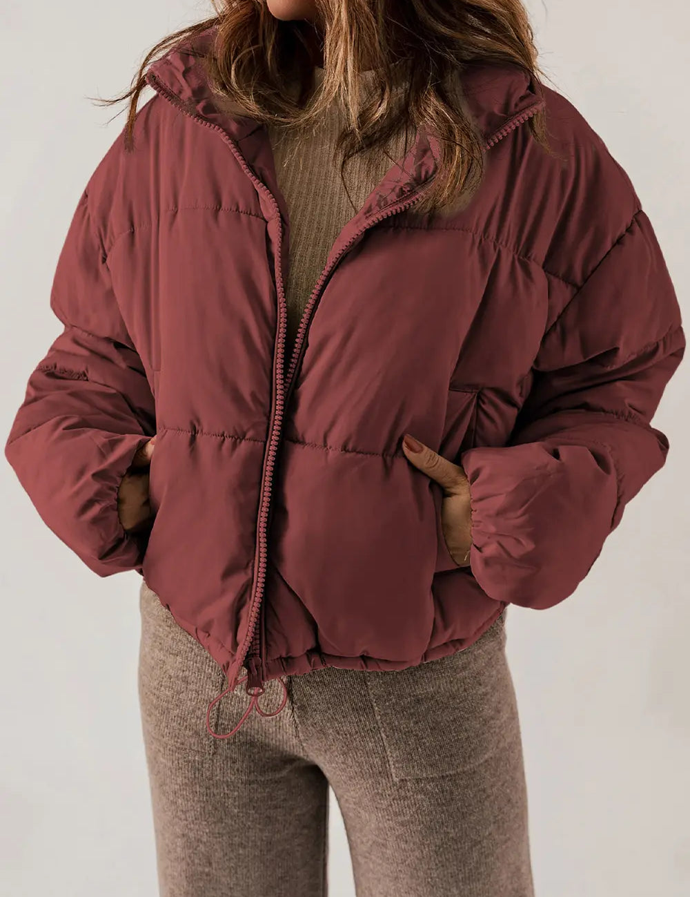 Maroon zip-up puffer jacket with hood and collar for winter warmth
