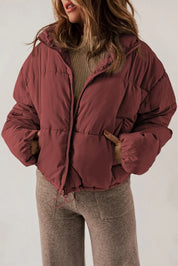 Maroon zip-up puffer jacket with hood and collar for winter warmth