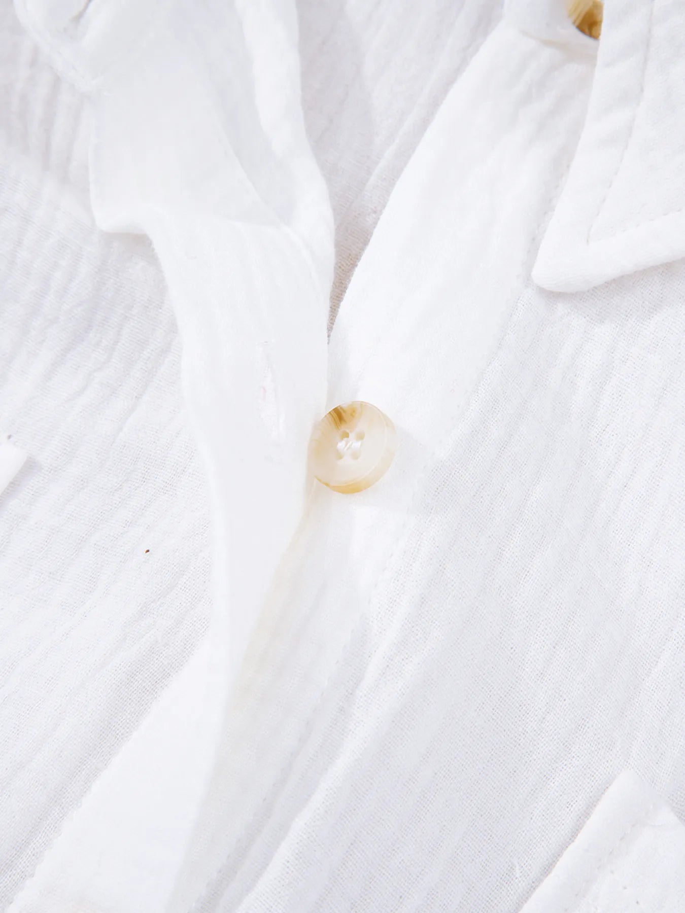 Translucent amber button on white womens lace sleeve cotton shirt