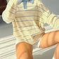 Women’s long sleeve striped polo collar sweater in cream with blue stripes