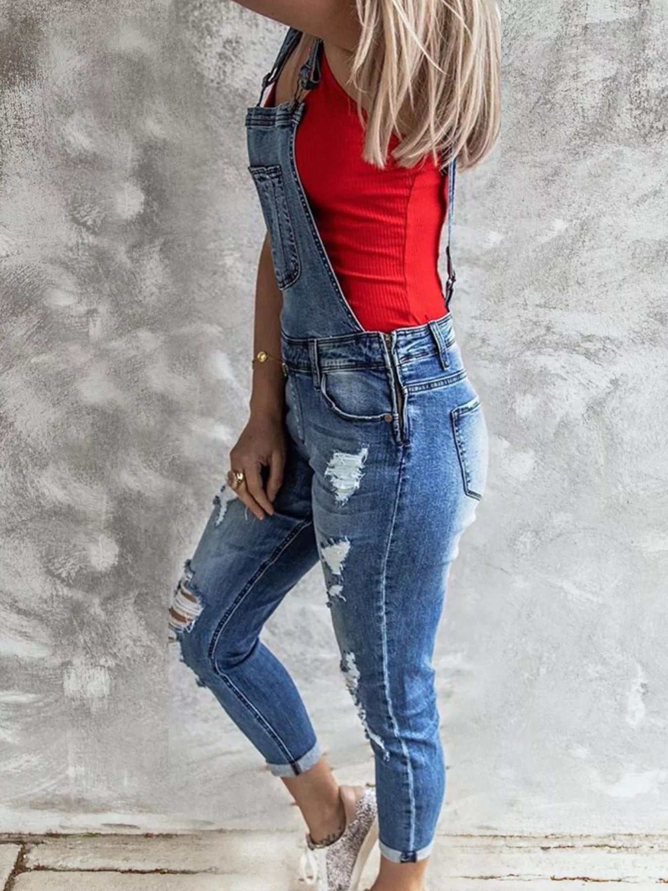 Daverri wide strap distressed denim overalls with blue patches and rolled cuffs