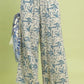 Umgee beige linen wide-leg pants with blue leafy print and raw frayed hems
