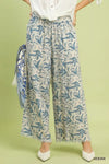 Umgee beige linen wide-leg pants with blue leafy print and raw frayed hems