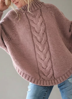 Cozy dusty rose cable-knit poncho sweater with ribbed cuffs