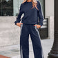 Navy blue women’s crewneck sweatshirt and sweatpants set with white side stripes