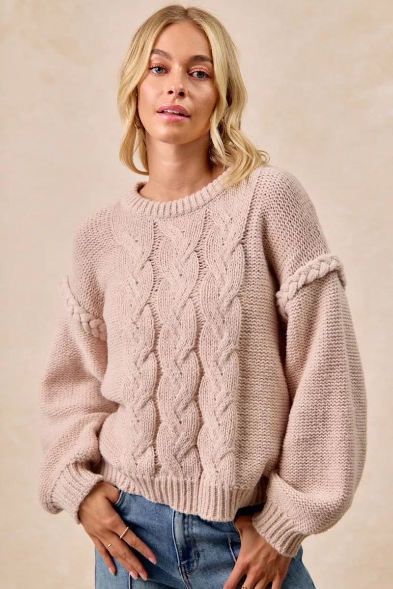 Pastel pink BiBi cable knit sweater with balloon sleeves and ribbed hem