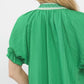 Vibrant green Umgee textured V-neck top with lace trim, gathered neckline and ruffled sleeves