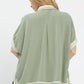 Mint Umgee linen button front top with cream contrast piping