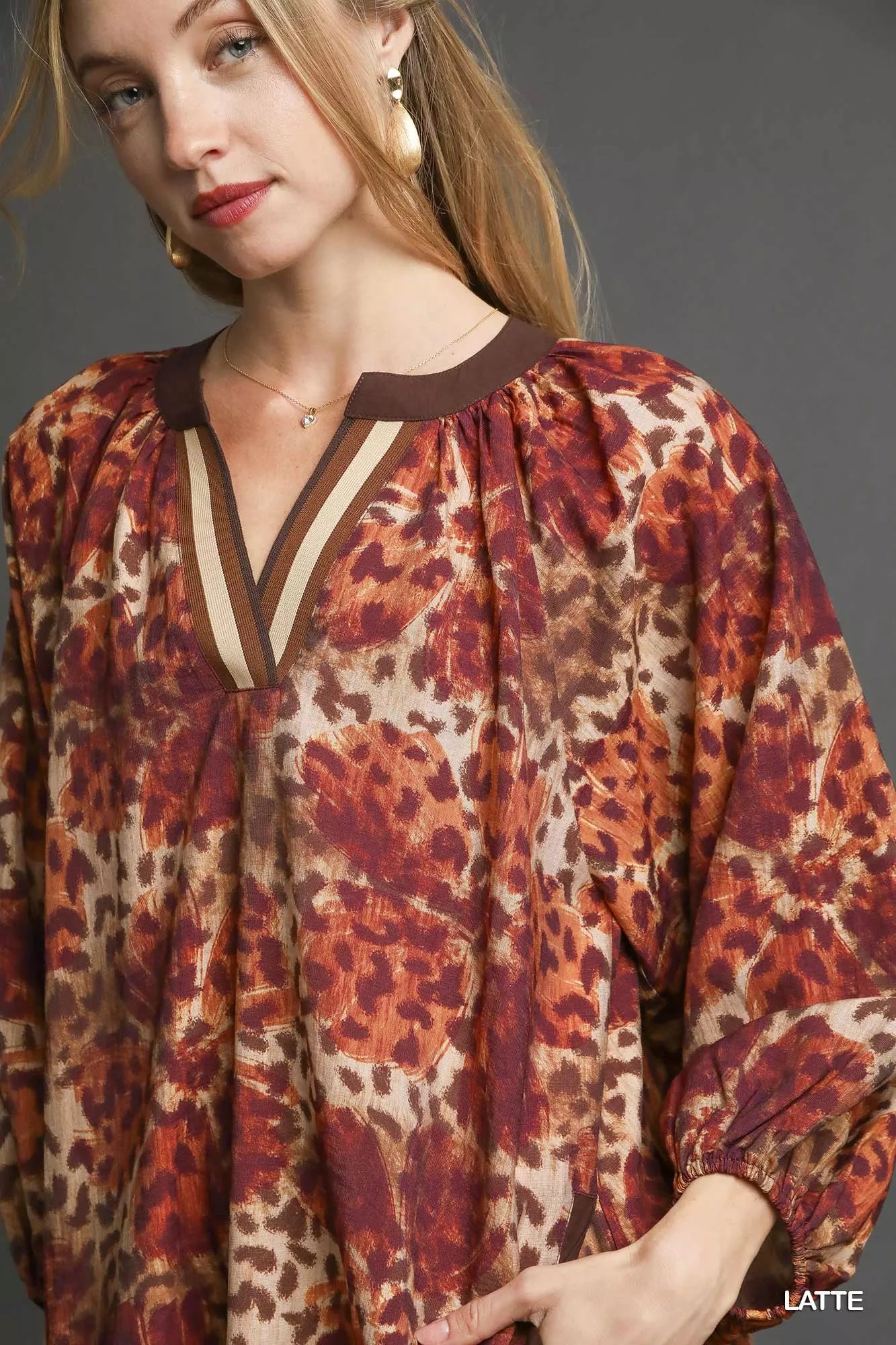 Leopard print boho tunic dress with brown trim and v-neck