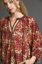 Leopard print boho tunic dress with brown trim and v-neck