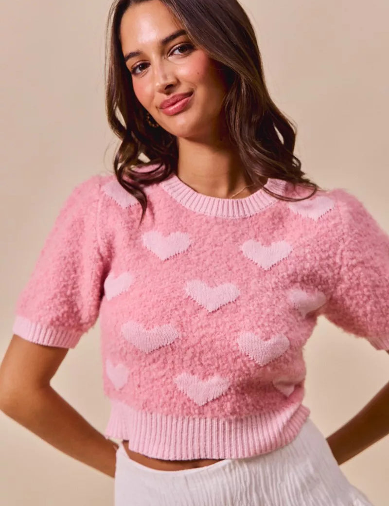 Pink fuzzy cropped SO ME sweater with white heart patterns