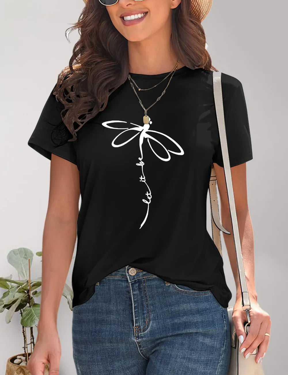 Black dragonfly print t-shirt with lace sleeves and layered necklaces
