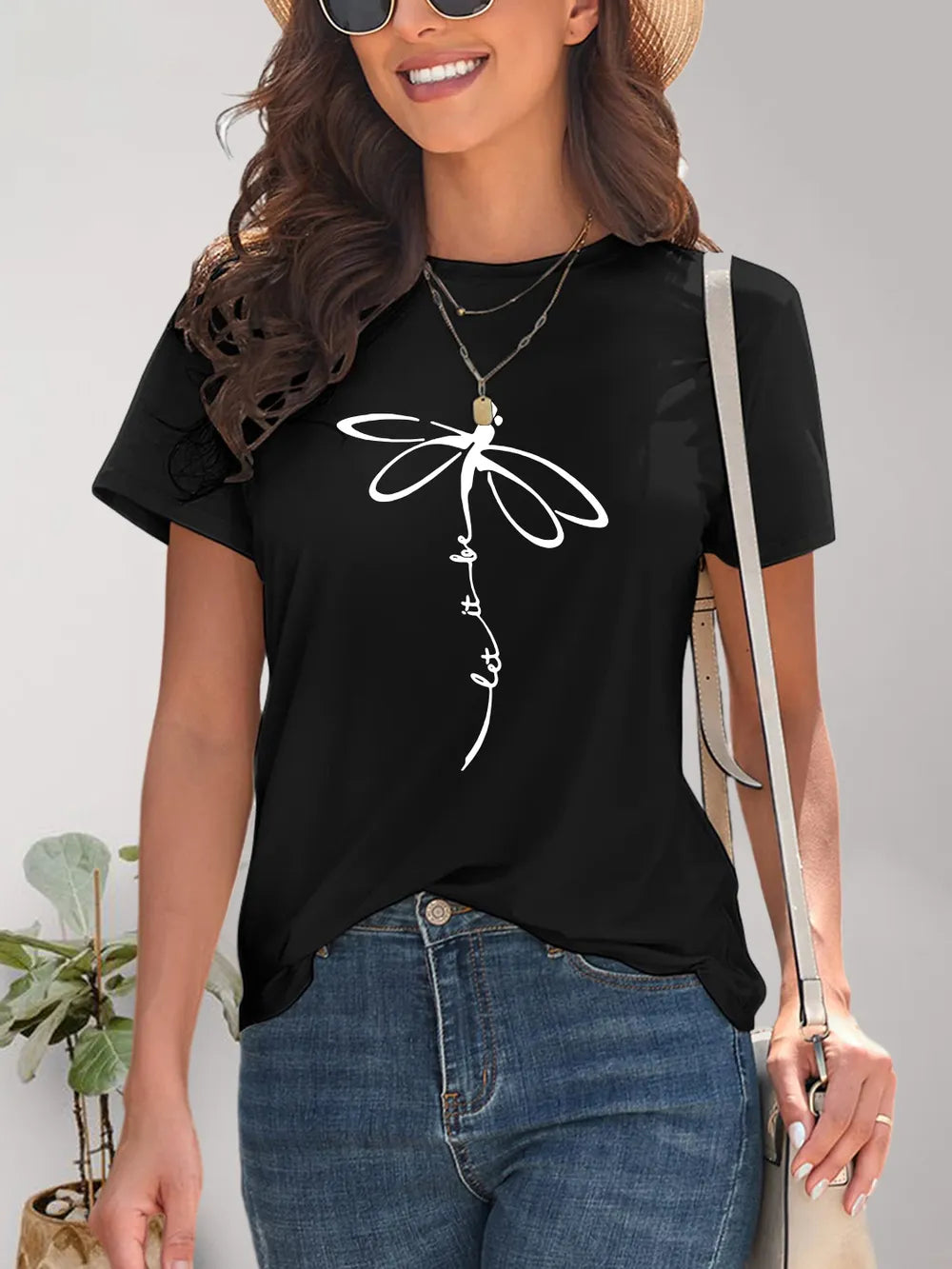 Black dragonfly print t-shirt with lace sleeves and layered necklaces