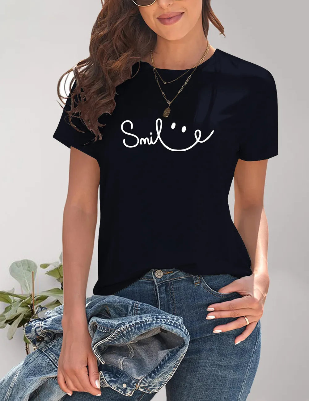 Black SMILE graphic tee with white smiley face, casual short sleeve