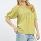 Sage-colored Umgee scalloped trim blouse with puff sleeves and embroidered neckline