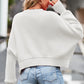 Off-white ribbed knit cropped sweatshirt with round neck and drop shoulders