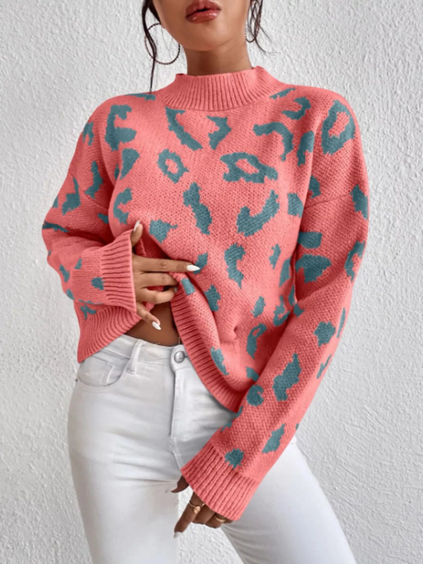 Pink leopard print mock neck sweater with long sleeves and ribbed cuffs