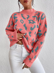 Pink leopard print mock neck sweater with long sleeves and ribbed cuffs