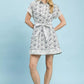Cream-colored Umgee Border Print Belted Shirt Dress with black floral pattern