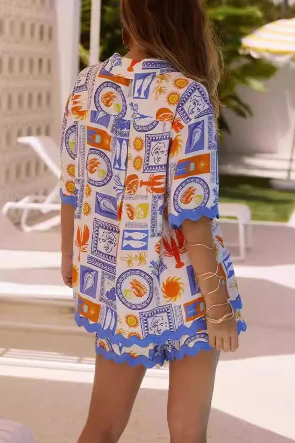 Vibrant bohemian print kaftan dress in white, blue, orange with scalloped edges