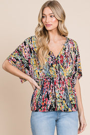 BOMBOM Printed Surplice Peplum Blouse | Daverri Fashions
