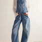Wide strap wide leg denim overalls in faded blue wash
