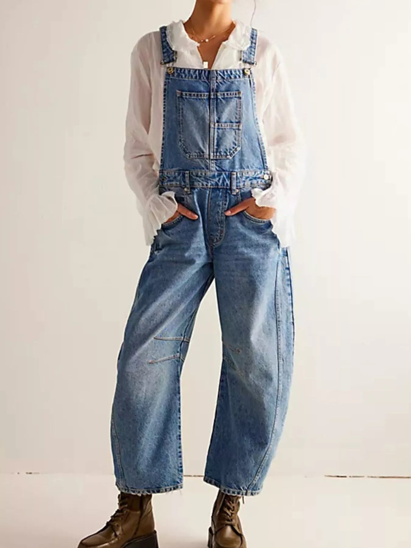 Wide strap wide leg denim overalls in faded blue wash