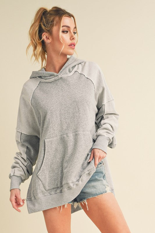 Aemi + Co Exposed Seam Side Slit Hoodie with Kangaroo Pocket Light Gray